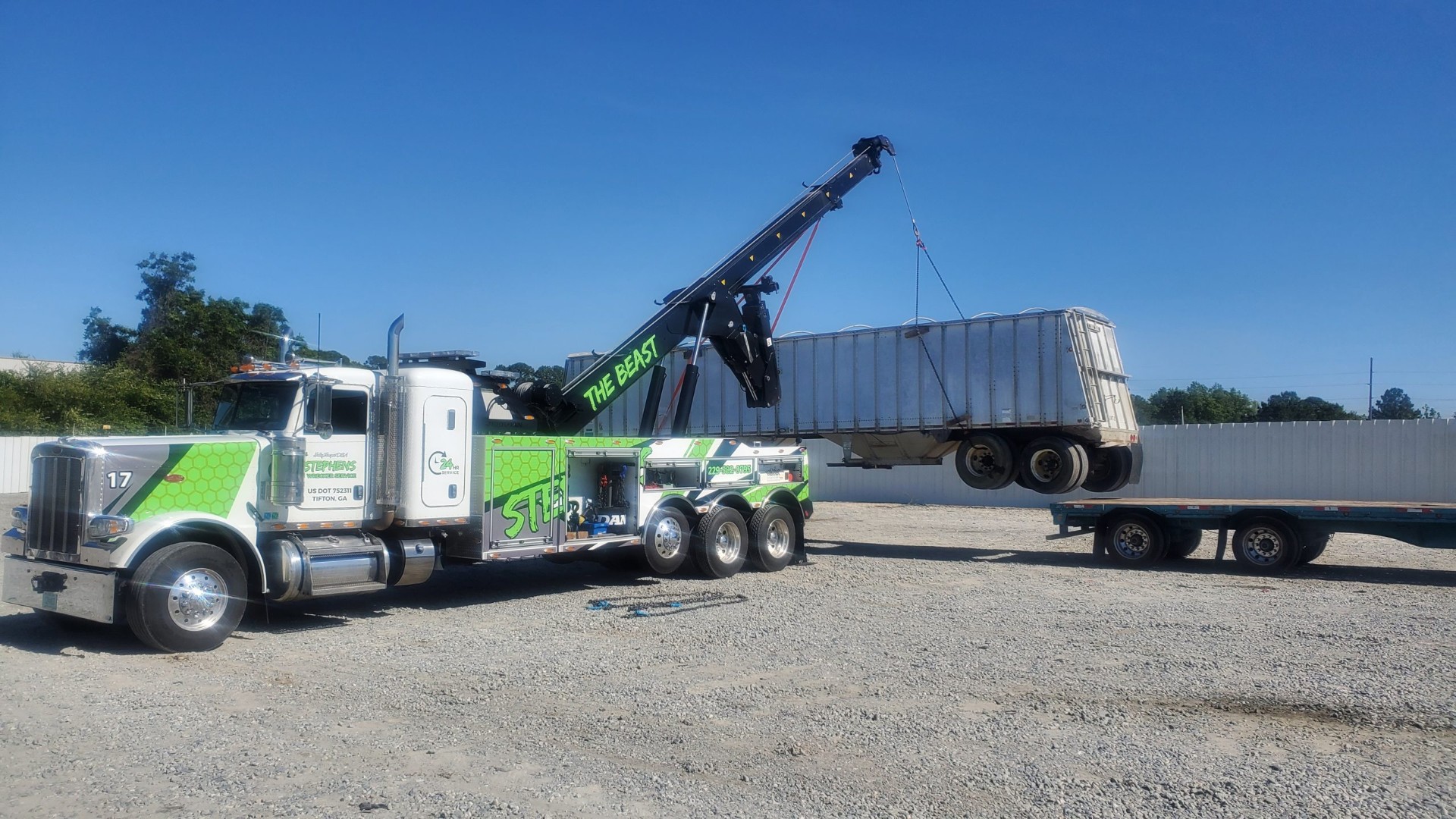 Rotator truck lifting trailer for recovery near Lenox